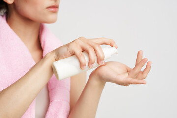 women apply hand lotion clean skin rejuvenation dermatology