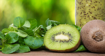 Naklejka na ściany i meble organic fruit and vegetable juice or smoothie with green background