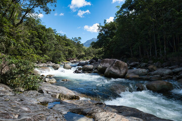 Water flowing at Mossman Gorge locate in the rural locality in the Shire of Douglas, Queensland,...
