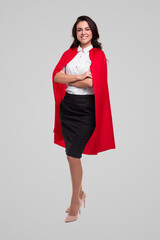 Confident business lady in superhero cape