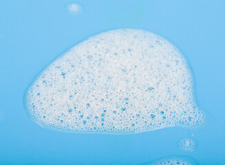 Soap foam on a blue background.