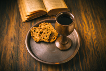The sacrament of holy communion - bread, wine and bible