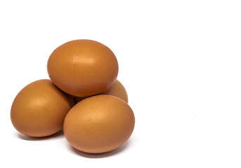 Pyramid stack of hen eggs isolated on a white background