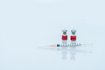 Covid-19 Corona vaccine vials medicine drug bottles syringe injection. Vaccination, immunization, treatment to cure Covid 19 Corona Virus infection. Healthcare And Medical concept.