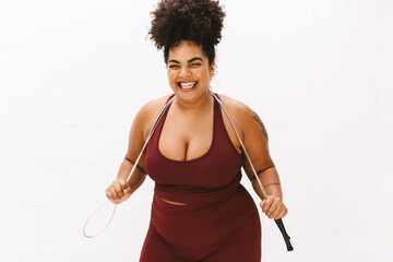 Healthy woman holding skipping rope