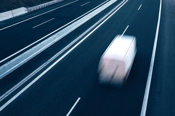 Fast moving blurry cars driving on the highway