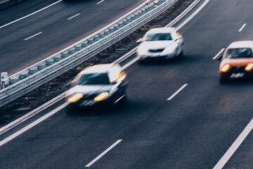 Fast moving blurry cars driving on the highway
