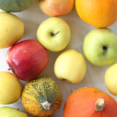 apples and pumpkins top view. autumn still life on the table