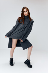 stylish woman in sweater coat boots naked legs model