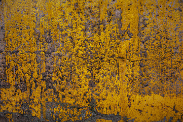 yellow paint pattern on old concrete wall