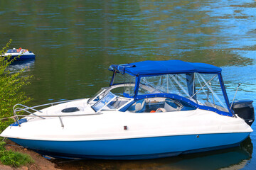 Fototapeta premium pleasure motor boat near the coast