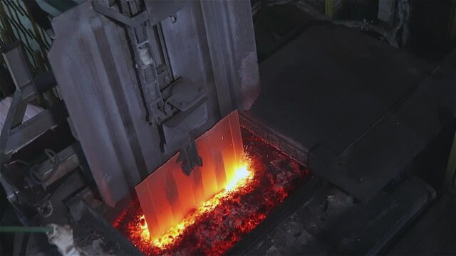 The furnace with molten metal, the melting of copper in the furnace, the process of melting copper in the furnace