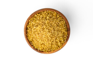 Bulgur in wooden bowl isolated on white background.