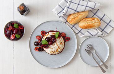 Grilled Camemberts cheese, cherries with honey and balsamic vinegar syrup