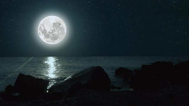 moon against a bright night starry sky reflected in the sea. Elements of this image furnished by NASA