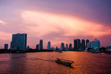 Fototapeta na wymiar sunset river city and ferry boat in Bangkok