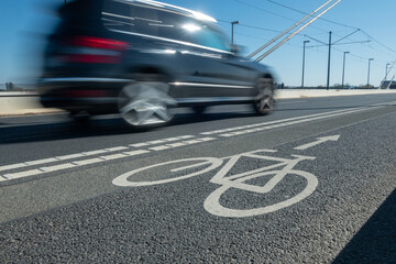 City street bicycle lane in heavy traffic with motion blur