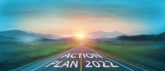 Action plan 2022 concept. word action plan 2022 written on the road in the middle of asphalt road...