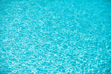 Tansparent clear calm water surface texture. Abstract nature background. Sea water pattern.