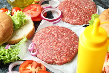 Concept of cooking burger with burger ingredients, closeup