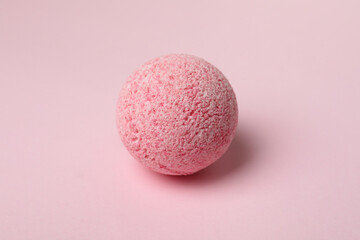 Bath ball on pink background, close up