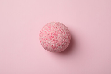 Bath ball on pink background, close up