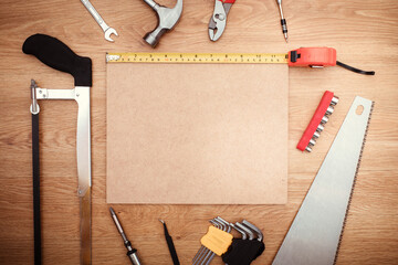 Working tools on wooden background. top view