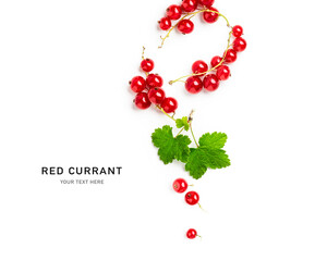 Red currant berries with leaves creative layout.