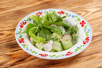 fresh salad on the wooden background