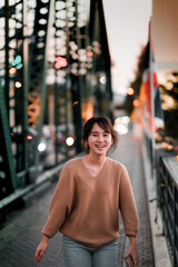 Asian teenage girl relax time, teenage girl in city walking street smile happy,