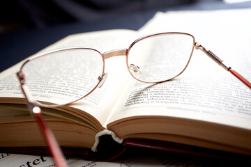 glasses on the book pages