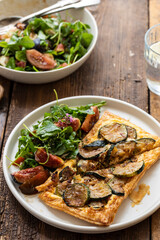 Puff pastry tart with caramelized courgettes and cheese with side of fig salad