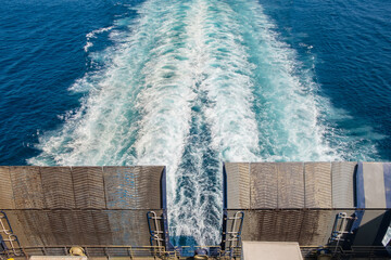 Blue sea waves. Ferry ship wave trail