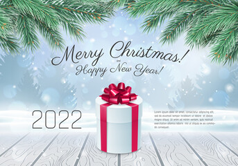 Happy New Year card with text and Xmas pine. 2022 Merry Christmas festive banner with present box on wooden floor against blurred background and snowflakes flying realistic vector illustration