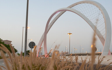 Doha, Qatar - May 26, 2021: Al Wahda Bridge in doha city. known as 5/6 Bridge of Arch.Doha, Qatar -...