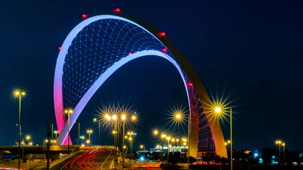 Fotobehang Doha, Qatar - May 26, 2021: Al Wahda Bridge in doha city. known as 56 Bridge of Arch. © MSM