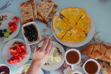 Fototapeta na wymiar Breakfast table shot contains different types of foods. Turkish-Mediterrannean breakfast