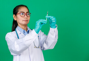 Asian female doctor wearing lab coat holding syringe with Covid 19 vaccine smiling. Concept for Covid 19 vaccination