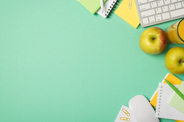 Top view photo of workplace keyboard mouse notebooks sticker note paper pens clips apples and glass...
