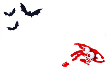 Halloween background made with paper bats and blood with scary eyes isolated on white.Copy space template.