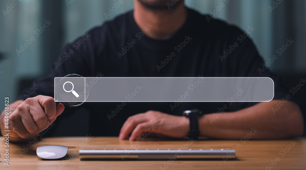Fototapete Data Search Technology Search Engine Optimization. man's hand holding magnifying glass.and Searching for information. Using Search Console with your website.