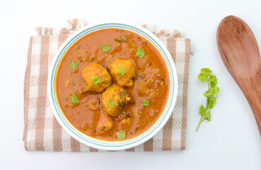 Spicy stew with lentil balls also known as Paruppu Urundai Kuzhambu