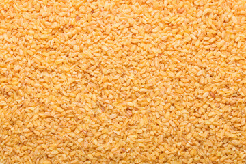 Raw bulgur food background. Dry bulgur grain. Healthy eating. Organic product. Top view.