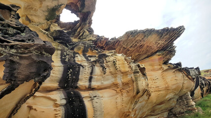 Eroded and Weathered Sandstone Cliff Cape Banks Sydney in the Botany Kamay Bay National Park. A hole has been eroded in the roof