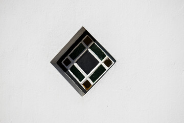 An old window, set on one corner