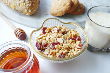  cereal breakfast in bowl ,bread and honey on white background 