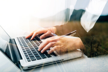 Businessman holding tablet and checking analyzing sales data growth graph chart and stock market on global networking. Business strategy, planning and digital marketing on blue background.