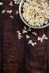 Salted Pop Corn In Bowl on wooden table