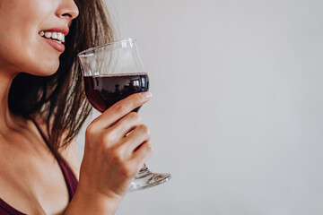asian woman drinking wine at home.selective focus