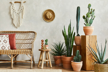 Stylish composition of cozy living room interior with copy space, lot of cacti and plants, wooden cubes and rattan accessories. Beige wall, carpet on the floor. Plants love concept. Template. © FollowTheFlow